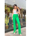 Зелені брюки з розрізом